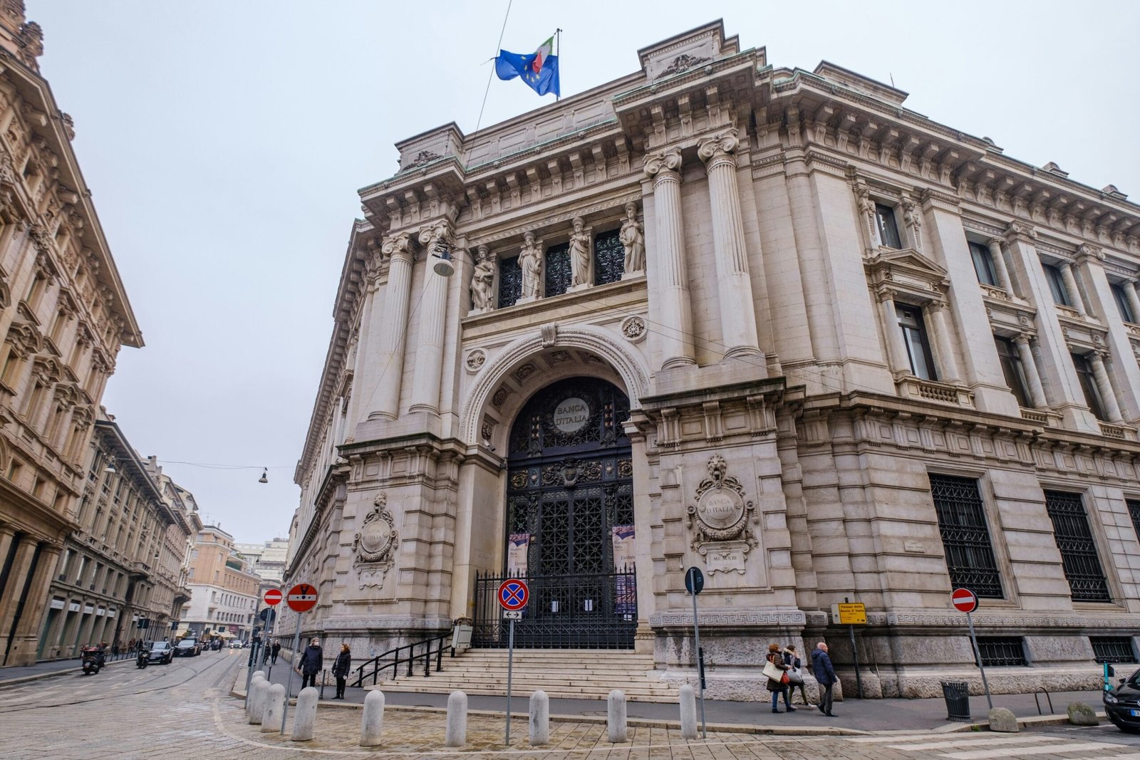 a large stone building with a flag on top